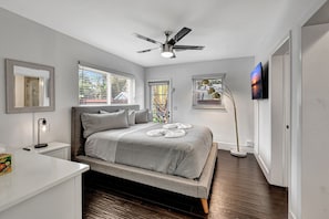 The ultimate bedroom getaway: king bed, smart TV, and direct backyard access.