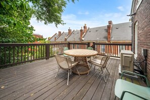 The balcony, featuring stairs leading downstairs, invites you to explore outdoor spaces effortlessly, creating a harmonious connection between levels.