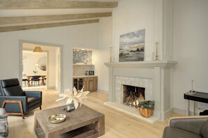 Living Room with Candle-Lit Fireplace and Streaming Smart TV