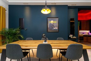 Spacious dining area with a wooden table and six comfortable chairs