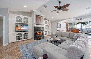 Relax and Kick Back At Tiki Time in this Bright and Comfortable Living Room