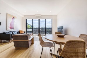 The open-plan dining room adjoins the living and kitchen areas for effortless social cohesion and flow.
