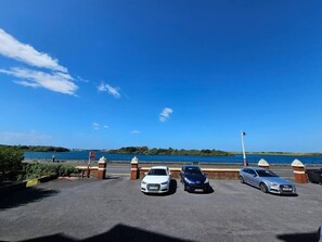 Car park with view of marine lake to front of the property 