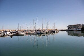 Watch the boats come and go from the Marina, with glimpses of the water to be enjoyed from the balcony.