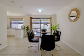 A large dining table makes it easy to come together for a shared meal at home.