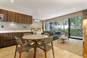 Spacious dining table seating four, perfect for family meals or gatherings.
