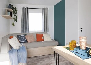 Cozy living area with vibrant decor, perfect for relaxation and socializing.