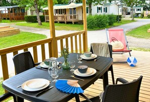 Gather around this inviting outdoor table, where meals are paired with fresh air, good company, and a peaceful view.