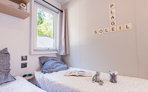 Drift into relaxation in this charming bedroom, where soft decor and natural light create the perfect setting for unwinding.
