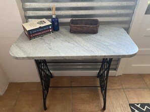 Catch all table for keys, sunscreen, “smalls” at front door