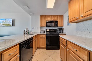 Prepare culinary delights in our well-equipped kitchen, where every detail is designed for convenience and functionality.