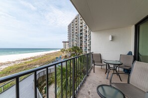 Your private beachfront balcony overlooks the Tower 2 pool/hot tub and the Gulf of Mexico