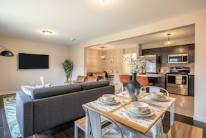 Enjoy dining in our comfy, wooden dining area that seats up to four people. This is right beside the kitchen for easy cooking and dining!