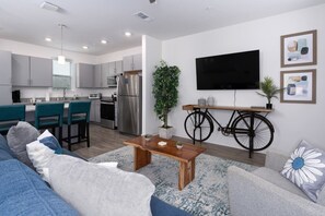 Spacious Living Room off the kitchen with Smart TV