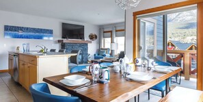View from the dining area, taking in the deck, kitchen and living room