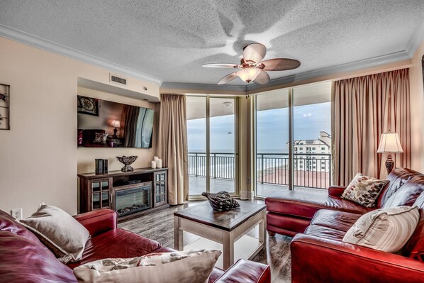 Enjoy the comforts of home in the living room while watching the waves roll in