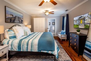 The bedroom is fresh and modern, and outfitted with crisp white linens.