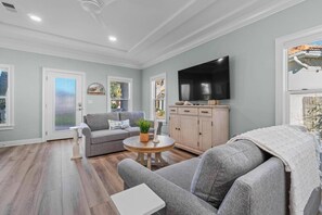 Couches in living room with TV.