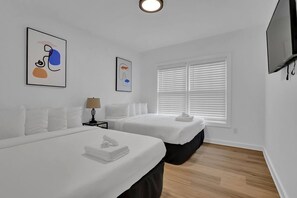 Perfect for group stays—this bedroom offers two queen beds for ultimate comfort!