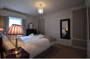 The lovely and comfortable master bedroom with king size bed. 