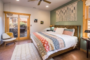 Master bedroom with attached bath, closet and patio doors that open to hot tub