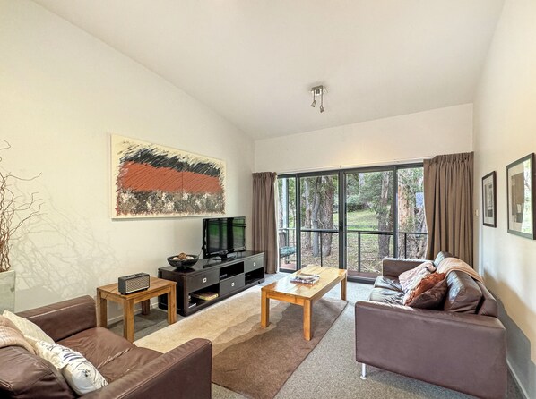 Seamless integration of living, dining, and kitchen areas, fostering connectivity and modern living.