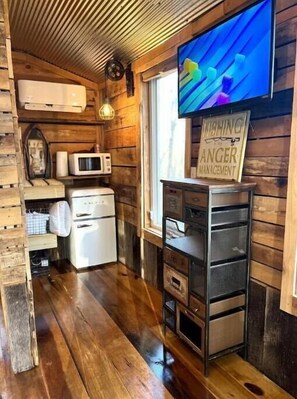 Small fridge, microwave, and coffee maker