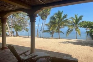 Patio view of the beach and ocean from the lower level suite B 