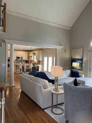 Open floor plan with seamless flow between living area and large kitchen