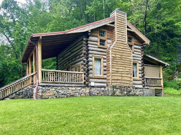 The cabin is a work of art, made of of timbers and riverstone