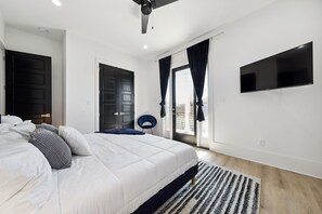 Bedroom 2- king bed, wall mounted TV, jack and jill bath w/bedroom 3, balcony