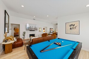 Pool table, living room. peekaboo to 3rd bedroom mural. 