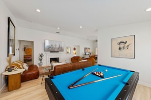 Pool table, living room. peekaboo to 3rd bedroom mural.
