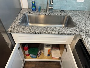 Fire extinguisher, 5 trash bags, dishwasher pods.