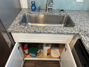 Fire extinguisher, 5 trash bags, dishwasher pods.