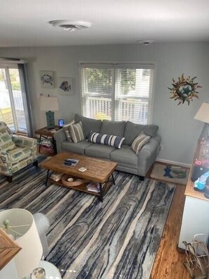 Living room from stairs leading up to other bedrooms