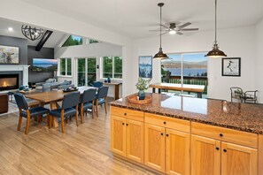 Prepare delicious meals together in the fully-stocked, open concept kitchen with a view