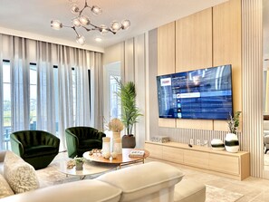 Elegant living room, relax with our 75" Smart TV