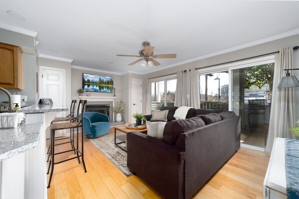 Living room is open to kitchen with marina views