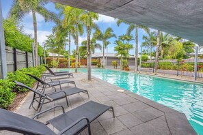 The complex features a shared resort-style swimming pool, offering a relaxing space to unwind and enjoy the tropical climate. Perfect for a refreshing swim or lounging by the water during your stay.