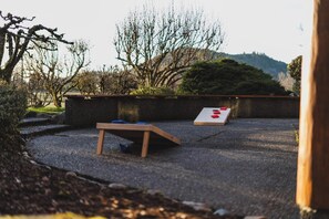 Enjoy some outdoor games at the house including Cornhole.