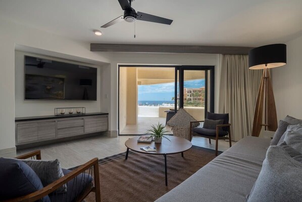 Huge Smart TV in ocean view living room
