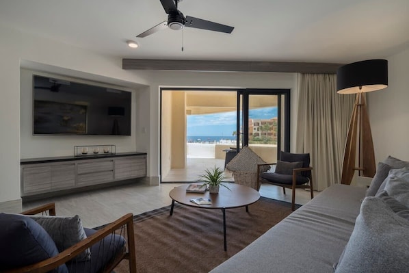 Huge Smart TV in ocean view living room