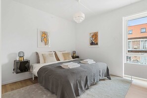 Master bedroom with king size bed and full size mirror