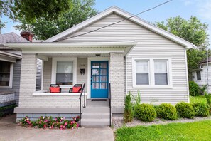 Picture yourself enjoying your morning coffee or evening cocktail on this adorable covered porch. 