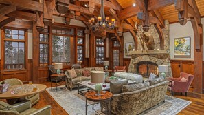 Luxurious great room on main level with fireplace and mountain views