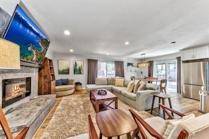 Enjoy the large living room with massive HDTV above the gas fireplace