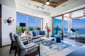 Indulge in the breathtaking panorama of the ocean right from the cozy  confines of your living room