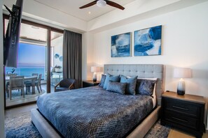 The luxury master bedroom features a smart TV, ensuite bathroom and access to the private balcony