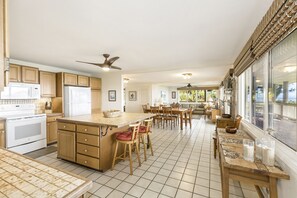 The spacious kitchen has plenty of storage and workareas.